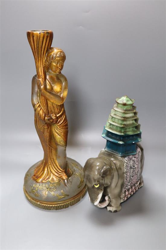 A late Victorian painted moulded glass candlestick, height 29cm, and a Rosenthal porcelain ceremonial elephant model, 19cm